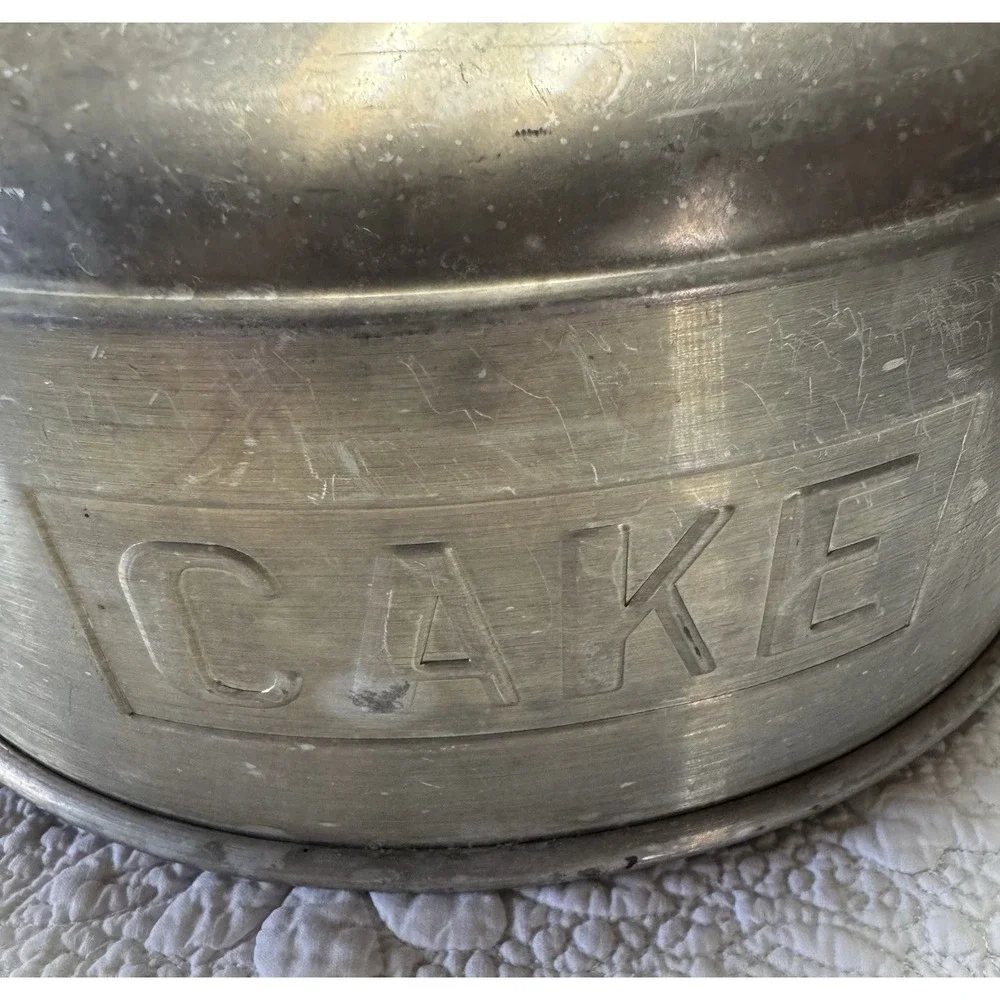 vintage 1950s‎ aluminum cake topper that says in embossed letters 